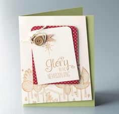 a close up of a greeting card with a button on the front and bottom corner