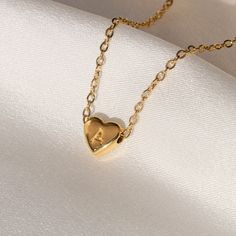 "Heart Initial Necklace STYLING TIP : pair it with these necklaces : Paperclip choker: https://www.etsy.com/listing/1026572431 Pearl choker: https://www.etsy.com/listing/843373640 ► PRODUCT DETAILS * Made with full gold pigmented stainless steel for a waterproof wear * Coated with a tick layer of 18k real gold - PVD coating technique My necklaces have 5x layers of solid 18k gold with PVD technique of plating, and are 100 times more resistant than traditional methods of gold plating over sterling Dainty Personalized Heart Necklace With Initial Pendant, Personalized Heart Initial Necklace For Anniversary, Personalized Heart Initial Necklace For Anniversary Gift, Dainty Personalized Heart Necklace With Initial, Dainty Personalized Initial Heart Necklace, Heart-shaped Initial Necklace For Anniversary Gift, Initial Pendant Heart Necklace Gift, Heart-shaped Initial Necklace For Anniversary, Personalized Heart Initial Necklace