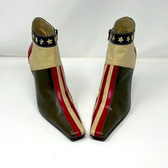 Be retro cool wearing these vintage ankle boots by Moschino. Metal stars around the top of the leather boots. Unique flag design with stripes. Olive green, ivory and red leather. Slight surface scratches and a few dings in the leather. Leather Size 38 1/2 M No Box Elongated Toe Made in Italy Powered by ExportYourStore.com 1960 Mod Fashion, Shoe Concept, Air Jordan Red, Dirty Boots, Moschino Shoes, Vintage Moschino, Tommy Hilfiger Handbags, Pointy Shoes, Blue Sundress