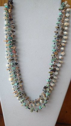 This gorgeous multi-strand necklace has three strands of natural rock. The colors are white, torquoise, and brown. This necklace is comfortable and easy to wear with a hand made by me clasp. It measures at 17 and 1/2 inch's long. Natural Rock Necklace, Rustic Bracelet, Handmade Statement Necklace, Rock Necklace, Jewerly Beads, Necklace Ideas, Stone Beaded Necklace, Hippie Necklace, Natural Rock