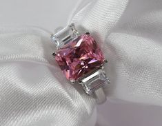 pink cocktail ring, pink gemstones, pink topaz ring, engagement jewellery, gemstone jewellery, Silver Engagement Ring,Emerald Cut 925 Silver Wedding Ring, Pink Simulated, 3 Stone Solitaire Ring For Christmas Gift -The product is 925 sterling silver rhodium plated. -Choose your ring size from the variations section You can have it adjusted to your finger at any jeweler, or you can also choose from a variety of jewelers by measuring your finger at any jeweler. -Made to Order - elegant silver ring Promise Ring Emerald, Pink Cocktail Ring, Cocktail Rose, Engagement Jewellery, Pink Topaz Ring, Emerald Cut Ring, Art Deco Pink, Jewellery Gemstone, Ring Emerald Cut