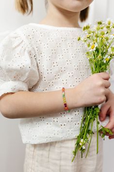 Let's vibe with this beautiful mix! These fun and vibrant colors are sure to be an eye catcher. From the deep magenta to the soft light green. This bracelet is sure to be a bold statement with your everyday pieces. The perfect accessory for every little girl! Made with the highest quality materials, this bracelet will look beautiful for years to come. Durable enough for play, precious enough to keep forever. Materials: 14k gold filled or sterling silver components. Nickel free. To learn more abo Green Tiny Beads Friendship Bracelets, Playful Green Stretch Bracelet As Gift, Playful Handmade Green Stretch Bracelet, Playful Green Handmade Stretch Bracelet, Green Tiny Beads Friendship Bracelets For Summer, Handmade Green Playful Friendship Bracelets, Playful Handmade Green Friendship Bracelets, Multicolor Bohemian Bracelet For Spring, Adjustable Green Playful Bracelets