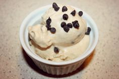 a bowl filled with ice cream and chocolate chips