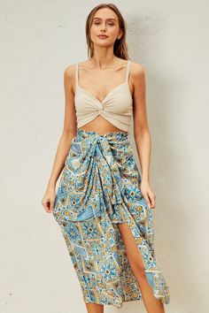 Indulge in your Moroccan dreams with our Sunrise Vacay Skirt! Featuring a stunning print and a flattering ruching effect, this satin skirt will be the center of attention on your next vacation. The full elastic waistband ensures a comfortable fit, while the unique design adds a touch of elegance to your wardrobe. PRE-ORDER 06/14/24 Fabric & fit: 100% rayon Model is wearing size small. Chic Beach Rayon Skirt, Chic Rayon Beach Skirt, Chic Rayon Skirt For The Beach, Beach Skirted Rayon Bottoms, Summer Beach Bottoms With Gathered Skirt, Summer Beach Gathered Skirt Bottoms, Beach Rayon Lined Skirt Bottoms, Summer Gathered Skirt In Rayon, Summer Rayon Gathered Skirt