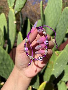 Evil Eye 🧿 Beaded Bracelet In many cultures, it is believed that evil eye bracelets protect against misfortune, evil looks and negative energy. Wear your bracelet for good luck and protection. ✨ Purple Evil eye boosts your imagination; Re-balances your life and removes obstacles. ✨ Evil Eye Bracelet Purple, Purple Evil Eye Bracelet, Violet Evil Eye Bracelet, Trendy Adjustable Evil Eye Friendship Bracelets, Evil Eye Round Beads Friendship Bracelets For Festival, Evil Eye Friendship Bracelets With Round Beads For Festivals, Festival Evil Eye Friendship Bracelets With Round Beads, Trendy Evil Eye Friendship Bracelets As Gift, Trendy Evil Eye Friendship Bracelets For Gifts