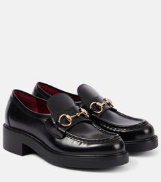 Horsebit leather loafers in black - Gucci | Mytheresa Gucci Calf Leather Loafers With Rubber Sole, Gucci Slip-on Loafers For Work, Elegant Gucci Loafers With Leather Footbed, Gucci Office Loafers With Rubber Sole, Office Gucci Loafers With Rubber Sole, Classic Gucci Calf Leather Shoes, Gucci Loafers In Calf Leather, Gucci Calf Leather Loafers With Branded Insole, Gucci Leather Loafers With Leather Footbed