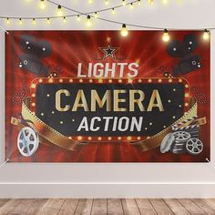 an image of a camera action sign on the wall with lights in the room behind it