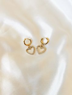 "Dainty Crystal CZ Huggie Hoop Earrings ❀❀ EARRING INFO: ❀❀ ➳ Huggie hoops are 201 stainless steel, with 316 surgical stainless steel pin ➳ Heart charm setting is gold plated brass ➳ Hoop size: 13.5mm ➳ Earring pin: 1mm ➳ Heart charm size: 15mm ❀❀ VIEW MORE EARRINGS: ❀❀ https://www.etsy.com/shop/bitsnpiecess/?section_id=23539584 ❀❀ RETURN POLICY: ❀❀ Please note that because of health/hygienic reasons, earrings cannot be returned or exchanged ❀❀ SHIPPING & PROCESSING: ❀❀ All products are MADE TO Gold Hypoallergenic Open Heart Hoop Earrings, Gold Hoop Earrings With Heart Charm, Dainty Tarnish Resistant Hoop Earrings For Valentine's Day, Gold Small Hoop Heart Earrings For Anniversary, Gold Plated Hoop Earrings For Everyday And Valentine's Day, Valentine's Day Tarnish Resistant Hoop Earrings, Gold Hypoallergenic Heart Hoop Earrings, Gold Open Heart Hoop Earrings For Gift, Hypoallergenic Gold Heart-shaped Hoop Earrings