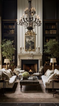 a living room filled with lots of furniture and a chandelier hanging from the ceiling