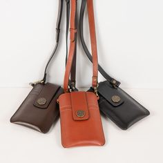 Crafted with the design DNA of equestrian heritage, the Austin Cognac Phone Tote embodies a perfect blend of style and functionality. Made from luxurious Italian leather, it transforms from a sleek phone wallet to a crossbody leather bag with an adjustable strap. Featuring a secure Horseshoe Medallion snap, hidden credit card slots, and additional space on the reverse side, it's designed for ease and elegance. Finished with a functional and stylish easy wear, it's ideal for any occasion. Materia Modern Equestrian, Lucky Horseshoe, Leather Hardware, Black Phone, Deep Brown, Signature Print, Phone Wallet, Phone Bag, Brass Hardware