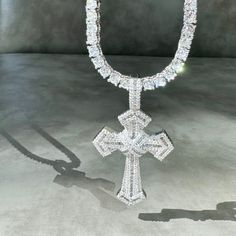 Introducing our stunning Silver Enchanted Cross Necklace! Prepare to turn heads and capture attention with its mesmerizing sparkle and shine. This necklace is truly a showstopper that exudes elegance.The focal point of this necklace is its beautiful cross pendant, meticulously paved with high-quality cubic zirconia crystals. These crystals create a dazzling effect, catching the light from every angle and reflecting it in a mesmerizing display of brilliance. The intricate detailing of the cross a Luxury Handmade German Silver Necklace, Crystal Cross Jewelry With Adjustable Chain, Crystal Cross Necklace With Adjustable Chain, White Gold Bling Cross Jewelry, Crystal Rhinestone Cross Pendant Jewelry, Crystal Cross Pendant Jewelry With Rhinestones, Crystal Cross Pendant With Rhinestones, Crystal Cross Clavicle Chain Jewelry, Crystal Clavicle Chain With Cross Shape