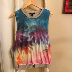 Forever 21 Palm Tree Muscle Tee. Brand New, With Tags! High Neck, Sleeveless. Grey Back, Blue, Pink, Yellow, Orange, Purple On Front. Perfect For Beach, Pool, Vacation, Festival Wear! Follow And Share! Summer Multicolor T-shirt With Rainbow Print, Trendy Summer Tank T-shirt, Sleeveless Multicolor Graphic Print T-shirt, Trendy Multicolor Summer T-shirt, Trendy Rainbow Print T-shirt For Summer, Trendy Multicolor Tops With Rainbow Print, Colorful Rainbow Print Summer T-shirt, Multicolor Rainbow Print T-shirt For Summer, Summer Printed Crew Neck Tank Top