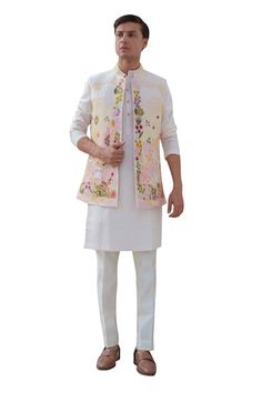 Multicolor bundi with thread embroidery in floral pattern. Paired with ivory kurta and trouser. - Aza Fashions Spring Chanderi Nehru Jacket With Resham Embroidery, Spring Resham Embroidery Chanderi Nehru Jacket, Spring Nehru Jacket With Resham Embroidery In Chanderi, Designer Sleeveless Embroidered Nehru Jacket, Sleeveless Embroidered Nehru Jacket For Designer Wear, Spring Embroidered Chanderi Sherwani, Spring Wedding Chanderi Bandhgala, Spring Wedding Bandhgala In Chanderi, Chanderi Nehru Jacket With Floral Embroidery