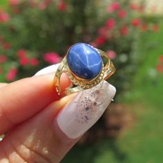 Vintage 18K Solid Yellow Gold Star Blue Sapphire Filigree Ring ....Marked 18K...Total of weights 2.7grams...Size 7.25...With 01 Oval Star Blue Sapphire 10 x 8.MM ( 2.54ct )Measure of Face 12.6MM...It's in very good condition. Blue Cabochon 14k Gold Ring, 14k Gold Blue Cabochon Rings, Celestial Blue Cabochon Jewelry, Celestial Style Blue Cabochon Jewelry, Blue Celestial Cabochon Jewelry, Formal Celestial Blue Ring, Blue Celestial 14k Gold Rings, Celestial Blue Oval Ring, Celestial Blue Gemstone Rings