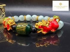 Gift yourself or your loveonce this beautiful bracelet. Crafted with 24 Karat Real Gold, Onyx, Agate and Angelite. Pixiu changes color. Metal: 24K Gold (Au999) Colour: Yellow Gold Gold Weight: Approximately 6.67grams Bracelet Width: Approximately 8mm Metal is Made of Real 24K Gold. Never Gold Filled. Never Gold Plated.  🧧Pixiu is a powerful Feng Shui symbol of wealth. It is believed that wearing the symbol of Pixiu brings money and good fortune to its wearer. This mythical creature is also thought to protect people from losing wealth. It also provides you not only physical protection, but also spiritual protection. 💥PLS FOLLOW US AND CHECK OUR OTHER LISTINGS. WE HAVE NEW STOCKS LISTED DAILY/WEEKLY.   OUR 24K GOLD IS MADE FROM 5G TECHNOLOGY What does 5G mean? 1, Grace : toughness, not eas Gold Jade Crystal Bracelet Gift, Gold Jade Bangle Bracelet, Elegant Green Bracelet For Good Luck, Yellow Gold Jade Bracelets As Gift, Yellow Gold Jade Bracelets For Gift, Flexible Beaded Bracelet For Gift, Spiritual Gold Bracelet With Round Beads As Gift, Red Jade Bracelet As Gift, Red Jade Bracelet Gift