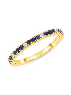 a yellow gold ring with blue and white diamonds