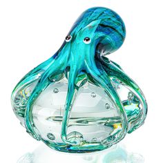 an octopus glass sculpture sitting on top of a table