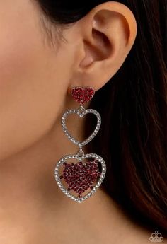 A red rhinestone-encrusted silver heart, white rhinestone-encrusted silver heart frame, and white and red rhinestone-encrusted layered heart frame gradually increase in size as they delicately interconnect and stack into a dazzling lure for an elegant effervescence. Earrings attaches to a standard post fitting. Sold as one pair of post earrings. Heart Frame, Red Earrings, White And Red, Silver Heart, Post Earrings, Frame, Red, Silver, White