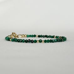 "Discover my minimalist and exquisitely natural emerald green malachite bracelet, elegantly made with 14k gold-filled or sterling silver accents, clasp and findings. This versatile gemstone beaded bracelet is perfect for layering or wearing on its own, achieving a minimalist aesthetic. A timeless jewelry piece that doubles as an ideal gift choice for engagements, weddings, birthdays, or anniversaries, suitable for moms, friends, girlfriends, teachers, or self-indulgence. DETAILS * Transformation Dainty Faceted Beaded Bracelets For Everyday Wear, Spiritual Round Beads Jewelry For Gift, Spiritual Round Beads Jewelry Gift, Adjustable Dainty 14k Gold Bracelet, Dainty Adjustable 14k Gold Filled Bracelet, Adjustable Beaded Bangle Jewelry, Adjustable Dainty 14k Gold-filled Bracelet, 14k Gold Filled Fine Jewelry Bracelets As Gift, Fine Jewelry 14k Gold Filled Bracelets As Gift