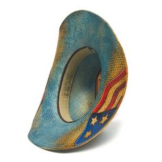 Our BLUE FLAG hat is a must-have for true fashion enthusiasts. Crafted from genuine Panama straw and a genuine leather band, this hat offers a classic American flag design under the 4 inch brim. The perfect finishing touch? An American eagle buckle. Don't miss out on the timeless elegance of the BLUE FLAG hat from the Stampede Collection. Star Cowboy Hat, Burn Hats, American Flag Design, Flag Hat, Blue Flag, Hat Collection, Love And Pride, Western Hats, Cowgirl Hats