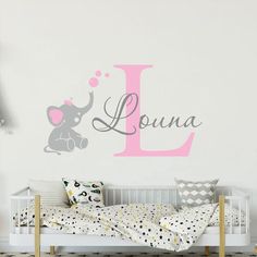 a wall decal with the letter l and an elephant