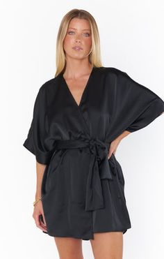 This fluttery robe is a bridal suite essential! Relaxed and smooth to the touch, it's perfect for the bride and her girls to wear while getting ready for the wedding. Elegant V-neck Robe In Solid Color, Elegant Loungewear Dress In Solid Color, Elegant Robe For Wedding Night, Elegant Dresses With Tie Waist For Loungewear, Chic Satin Robe For Wedding Night, Elegant Sleepwear With Tie Waist, Elegant V-neck Bridesmaid Sleepwear, Spring Wedding Sleepwear With Kimono Sleeves, Chic Robe For Wedding Night And Spring