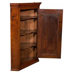 an old wooden cabinet with its doors open