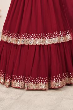 This is a 3-piece set. The set consists of blouse with sequins & zari detailing, v neck teamed with flared lehenga and a dupatta. No of piece - 3 piece Color- Red Fabric-Georgette Dupatta Fabric - Soft Net Blouse Sleeves-Above Elbow Sleeves Neck-V Neck Lehenga length: Floor Length Washing instructions: Dry Clean Work- Zari & Sequins Print Detailing. Flared lehenga Comes with Dupatta Customizations: available. Please add your measurements in the 'order notes' box during checkout. Model with height is wearing size Small. Stylish Lehenga, Flared Lehenga, Engagement Gown, Lehenga Crop Top, Georgette Material, Lehenga Choli Wedding, Floral Lehenga, Party Wear Lehenga Choli, Reception Gown