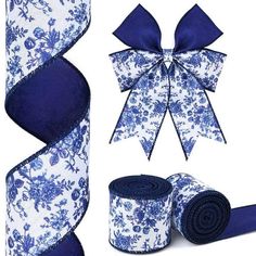 two rolls of blue and white floral ribbon with matching bow, one roll is rolled up