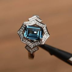 London blue topaz ring topaz promise ring emerald cut blue gemstone sterling silver November birthst London Blue Topaz Jewelry, Rainbow Topaz Ring, London Topaz Ring, Topaz Rings, Elegant Rings, Swiss Blue Topaz Ring, Blue Topaz Engagement Ring, Blue Topaz Jewelry, London Blue Topaz Ring