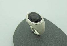 Elegant, simple silver ring with transversely aligned onyx in oval cabochon cut and beautiful dark black. Onyx oval 12 x 16mm All ring sizes are available. Please write your ring size in the comment field by checking out. On the following link, you will find the ring with a larger stone 20 x 15mm https://www.etsy.com/de/listing/228065410/grosser-onix-ring-in-silber-925?ref=shop_home_active_17 Minimalist Oval Cabochon Signet Ring For Formal Occasions, Minimalist Oval Cabochon Signet Ring For Formal, Modern Oval Cabochon Signet Ring For Formal Occasions, Modern Onyx Signet Ring With Polished Finish, Modern Oval Cabochon Signet Ring As Gift, Modern Oval Cabochon Signet Ring For Gift, Modern Oval Cabochon Dome Ring, Modern Black Oval Signet Ring, Modern Oval Cabochon Signet Ring