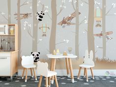 children's playroom with wallpaper featuring pandas and airplanes in the trees