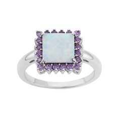 A lab-created opal serves as the focal point, while shimmering purple cubic zirconia stones add a colorful touch to this captivating halo ring. Comes in a gift box. RING DETAILS Width: .48 in. Metal: rhodium-plated sterling silver STONE DETAILS Stone type: lab-created opal Center stone size: 8.25 mm Shape: square Setting: prong CUBIC ZIRCONIA DETAILS Total weight: 5/8 ct. Shape: round Color: purple Setting: prong  Gender: female. Age Group: adult. Sterling Silver Opal Ring, Silver Lab, Pendant Ring, Right Hand Rings, Halo Pendant, Square Rings, Pendant Rings, Halo Ring, Opal Jewelry