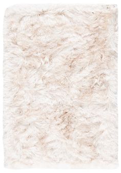 an area rug with white fur on it