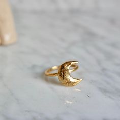 This ring is handmade by me and moulded bronze. Ring size is adjustable you can use for your every finger. Ring is 18 k gold. Crescent size is: 1.5 cm in height. Mystical Crescent Rings With Moon Charm, Celestial Gold Crescent Rings, Celestial Crescent Gold Rings, Mystical Crescent Moon Charm Rings, Nickel-free Celestial Moon Ring, Dainty Gold Moon Phase Rings, Dainty Gold Rings With Moon Phase, Adjustable Moon Shaped Celestial Rings, Gold Celestial Moon Ring