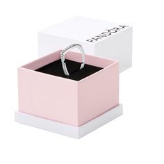 a pink box with a ring in it and a white box on the side that says rock