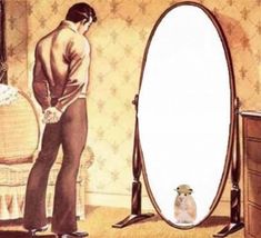 a man standing in front of a mirror looking at his reflection on the floor next to a dresser