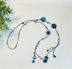 One of a kind!  A true statement piece!  Necklace that can be wear as plain lariat or choker. It's a strand - No hook, lock needed Accented with beads & stones to added more fun and color. It come with different color combination.  All flower are carefully handcrafted and made up of leather.   Necklace size: 36 inches lengh Adjustable Blue Lariat Necklace, Blue Adjustable Lariat Necklace, Blue Lariat Necklace With Adjustable Chain, Blue Long Lariat Necklace With Adjustable Chain, Adjustable Blue Necklace With Flower Charm, Blue Bohemian Necklace With Flower Charm, Blue Adjustable Lariat Necklace For Gifts, Adjustable Blue Lariat Necklace Gift, Adjustable Blue Lariat Necklace As Gift