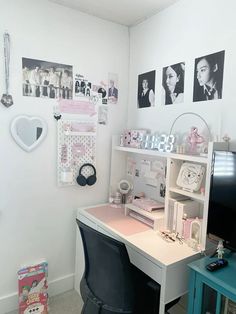 a room with a desk, chair and pictures on the wall above it that says hello kitty