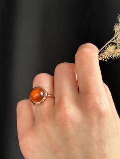 This modern take of cocktail ring is captivating with its honey warm hessonite garnet. Wear it for an iconic, style defining presence.  Known as a Stone of Whole Harmony, this ring harmoniously will match any look. Hessonite garnet cabochon 12 mm 9K solid rose gold Follow us on Instagram: https://www.instagram.com/missionewyork/ Sphere Ring, Silk Bracelet, Gold Statement Ring, Hessonite Garnet, Handmade Fine Jewelry, Solid Gold Chains, Gold Silk, Woven Bracelets, Iconic Style