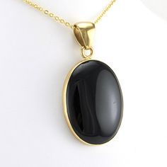 This genuine black onyx oval shaped gemstone has been skillfully crafted into a pendant with a blend of metals called alchemía. Pendant 2 1/2 inches long and 1 1/8 inches wide and sold separate from the chain shown. Style Number: 17759 Metal: Alchemía Gemstone: Genuine Black Onyx Dimensions: 2 1/2 inches long and 1 1/8 inches wide Handmade in Mexico Onyx Pendant, The Chain, Oval Pendant, Jewelry Trends, Black Onyx, Onyx, Gemstones, Chain, Pendant