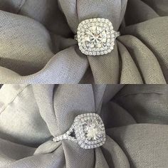 two diamond rings sitting on top of a gray cloth covered chair with grey fabric around it