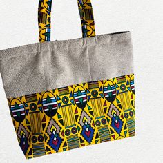 This cute colorful Tote bag will add style to any clothing and get ready for compliments.  It's handmade from a combination of plain color and bright multicolored  Cotton African  fabric which makes it unique and it will stand out. The bag measures approximately width 17 inches height 14 inches. The inside is lined and the Tote has a zipper to close.The bag has room to hold anything you may need. Multicolor Shoulder Bag With Zipper Pouch As Gift, Casual Multicolor Square Canvas Bag, Casual Yellow Shoulder Bag As Gift, Casual Multicolor Fabric Canvas Bag, Multicolor Zipper Pouch Bag For Daily Use, Multicolor Daily Use Bag With Zipper Pouch, Multicolor Rectangular Shoulder Bag With Zipper Pouch, Multicolor Rectangular Beach Bag For Daily Use, Multicolor Zipper Pouch Bag For Gift