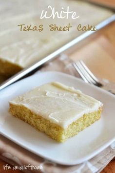 a piece of cake sitting on top of a white plate next to a knife and fork