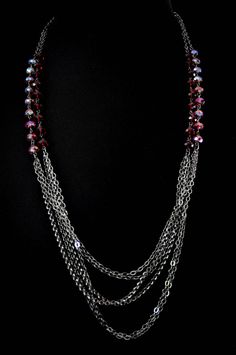 Light chain layered necklace with Red/Siam Swarovski crystals. Makes a great handmade gift to give on birthdays, holidays, on valentine's day or just to say thank you. Can be worn symmetrically or asymmetrically around the neck. Great for layering! Each necklace is packaged in a box, ready for gift giving. Matching earrings: https://anelladesigns.com/collections/catalogue/products/red-crystal-teardrop-earring-with-white-pearls * * * * * * * * * * * * * * * * * * * * * * * See a full description Party Multi-strand Crystal Necklaces With Faceted Beads, Multi-strand Faceted Beads Crystal Necklaces For Party, Multi-strand Faceted Beads Crystal Necklace For Party, Beaded Chain Jewelry For Valentine's Day Party, Valentine's Day Beaded Chain Party Jewelry, Valentine's Day Party Jewelry With Beaded Chain, Red Double Strand Jewelry With Faceted Beads, Multi-strand Crystal Beaded Necklace For Gift, Multi-strand Faceted Beads Party Necklace