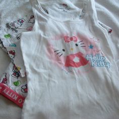 Hello Kitty Sanrio Pajamas 2 Piece Pajamas Set New Without Tags Size M Bottoms Waist Measures 14-14.5” Inches Lying Flat Not Stretched The Bottoms Are Cropped Measures 29”Inches From The Waist Band To The Bottom Hem Tank Top With Bottoms Wrinkles From Being Tucked Away In My Drawer. Never Worn From A Smoke Free Home Playful Fitted Loungewear Sets, White Pajama Party Sets For Spring, Cotton Sleeveless Bedtime Sets, White Spring Pajama Party Sets, Sleeveless Cotton Bedtime Sets, Summer Stretch Sleepwear Sets For Bedtime, Summer Bedtime Stretch Sets, Cotton Stretch Sleepover Sets, Stretch Cotton Sleepover Sets