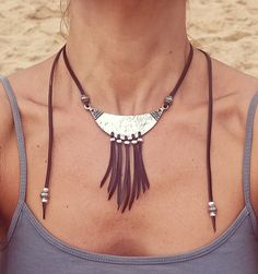 Leather Fringe Necklace for Women, leather Necklace, Statement Necklace, Statement Jewelry, Zamak Necklace belong to boho jewelry as well as bohemian jewelry, hippy jewelry carefully designed and crafted by EndiaSoul. Fashion silver bib necklace for women handmade of genuine cow leather and decorated with a silver bib, feathers and beads, all of them in silver plating of 8 microns of sterling silver. This boho necklace has adjustable fastener; a metal bead which you can move through the leather Festival Pendant Necklace With Adjustable Cord, Festival Choker Necklaces With Adjustable Cord, Festival Choker Necklace With Adjustable Cord, Bohemian Silver Necklace With Sliding Knot, Bohemian Lariat Necklace With Sliding Knot, Festival Necklaces With Adjustable Cord, Festival Jewelry With Adjustable Cord, Bohemian Festival Choker With Adjustable Chain, Hippie Festival Jewelry With Adjustable Cord