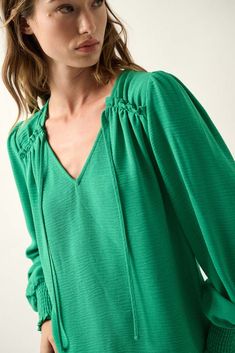 Grateful Spirit Solid Tie-Neck Peasant Top - ShopPromesa Peasant Style V-neck Blouse For Brunch, Spring Peasant Top With Smocked Cuffs And V-neck, Spring V-neck Peasant Top With Smocked Cuffs, Fall V-neck Smocked Top With Blouson Sleeves, Green V-neck Peasant Top For Fall, Fall V-neck Blouse With Smocked Bodice, Spring V-neck Peasant Top With Gathered Sleeves, Fall Green V-neck Peasant Top, Peasant V-neck Blouse For Brunch