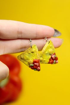 Embrace your love for Mexican food with these adorable salsa and chip dangle earrings. Handcrafted by skilled artisans, these unique pieces of artisan jewelry are designed to delight the foodie in you. Imagine the joy of dining out with friends, savoring your favorite dishes from your go-to restaurant (even if you've enjoyed them countless times before!). Food is more than just sustenance; it's about creating memories, forging connections, and sharing special moments around the dining table. We take pride in hand-making each earring personally, infusing them with care and attention to capture the essence of those joyful dining experiences. Our commitment to quality is unwavering, as we never outsource our products to cheap overseas factories. Feast your eyes on the vibrant and realistic ha Quirky Multicolor Dangle Jewelry, Quirky Multicolor Jewelry For Gifts, Quirky Handmade Drop Earrings, Quirky Dangle Jewelry For Gifts, Quirky Dangle Jewelry Gift, Fun Dangle Jewelry For Crafting, Quirky Dangle Jewelry As A Gift, Quirky Yellow Jewelry Gift, Quirky Yellow Jewelry For Gift