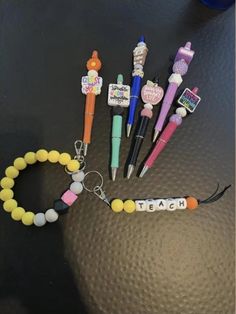 This would make a great gift for a teacher or school staff member or even just a gift for yourself!! You have some options when ordering, but if you want to customize completely, please message the shop first to see if it is possible.  Each order would include the "pencil" silicone wristlet keychain AND a "teach" keychain!! Options are available for what type of pen (beaded or focal) you would like in your order or if you just want the wristlet and keychain. The decision is yours!  The design of the pen will be picked by the shop that best fits the colors you picked for your keychain. If you are looking for a specific bead, please send a note.  DESCRIPTIONS:  Pen, Teach, Pen: includes "pencil" wristlet, "teach" keychain (you pick the color from the options in pictures), and you will get a Silicone Wristlet Keychain, Silicone Wristlet, Teacher School, Keychain Wristlet, School Staff, Pen Design, The Pencil, Wristlet Keychain, Silicone Beads